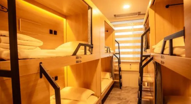 Кровать в общем номере Bu'er Folk Youth Hostel (Yanji Yanbian University West Market Store)