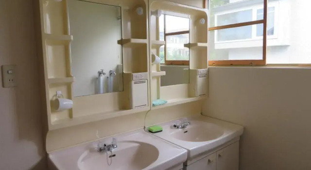 Кровать в общем номере Guesthouse Sakamichi Sampo