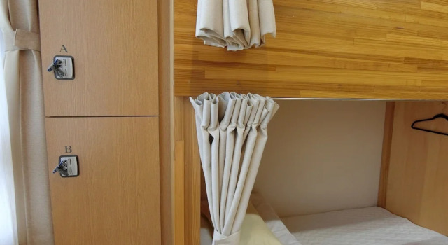 Кровать в общем номере Shimonoseki Hinoyama Youth Hostel KaikyonoKaze