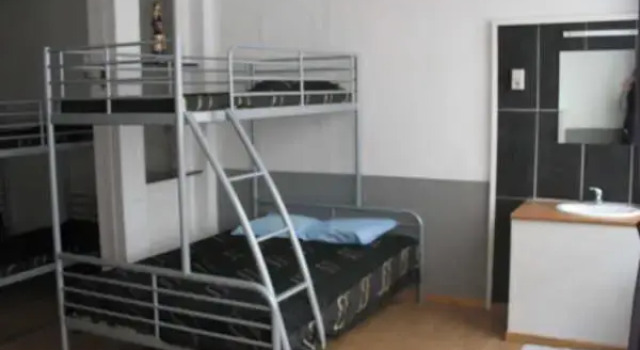 Кровать в общем номере Logies Lucullus
