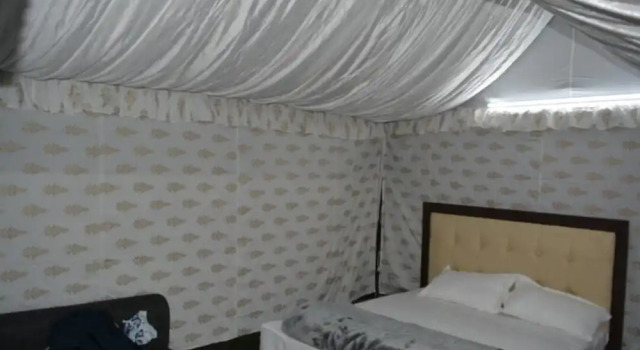 Кровать в общем номере Gurugram Resort