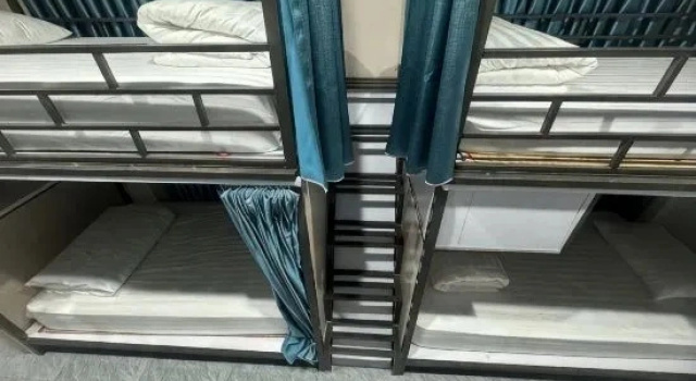 Кровать в общем номере Son Tinh Hotel