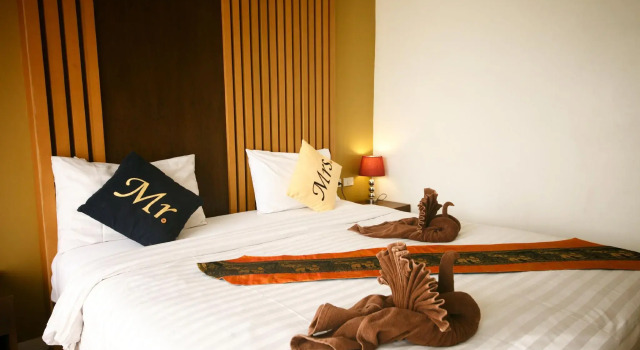 Кровать в общем номере Tropical Sunset Hotel Patong