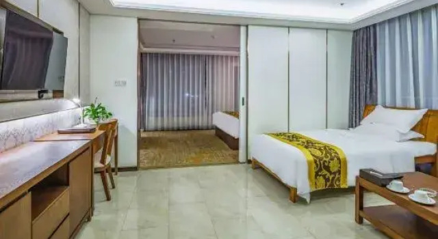Семейный люкс Deluxe Qingdao Xinlong Grand Hotel (Jinshatan)