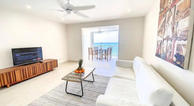 Pavillon Beach 9, feet in the water in Grand Case