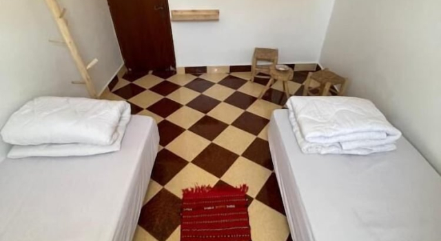 Кровать в общем номере Epicswellhouse