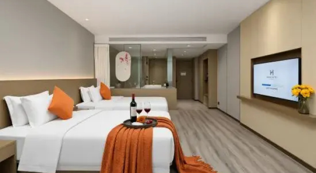 Кровать в общем номере NATO·QiXin Begonia Hotel