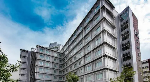 Кровать в общем номере Hotel Hewitt Koshien