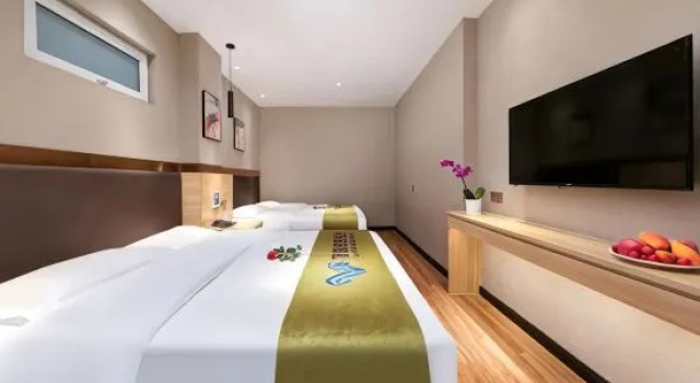 Кровать в общем номере Wan ye hotel