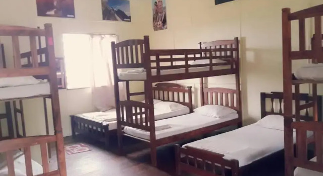 Кровать в общем номере D'Villa Rina Ria Lodge
