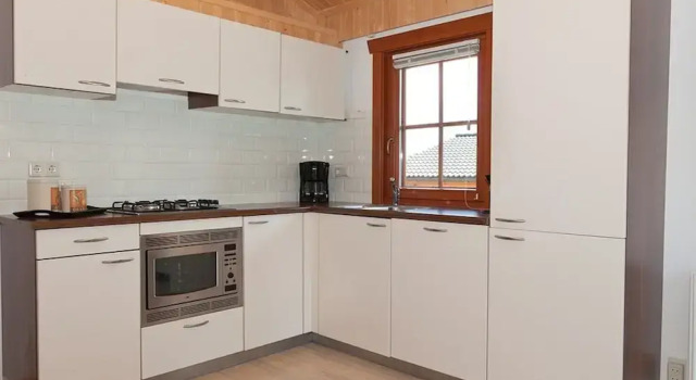 Коттедж Wooden Holiday Home with Microwave near Brunssummerheide