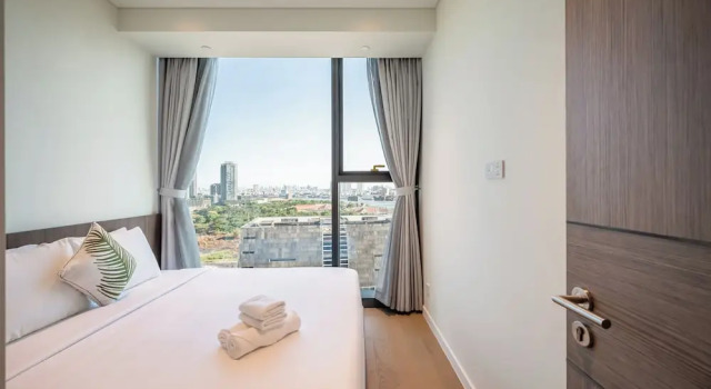 Апартаменты Deluxe с 2 комнатами с балконом и с видом на город The Metropole Sai Gon Residences