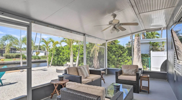 Коттедж Palm City Canalfront Home w/ Boat Dock & Fire Pit!