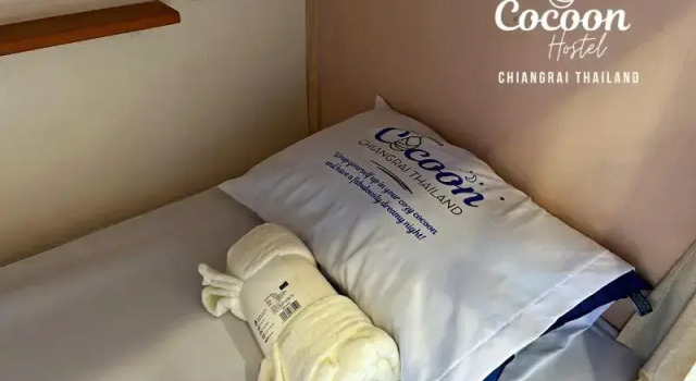 Кровать в общем номере Cocoon Chiang Rai City