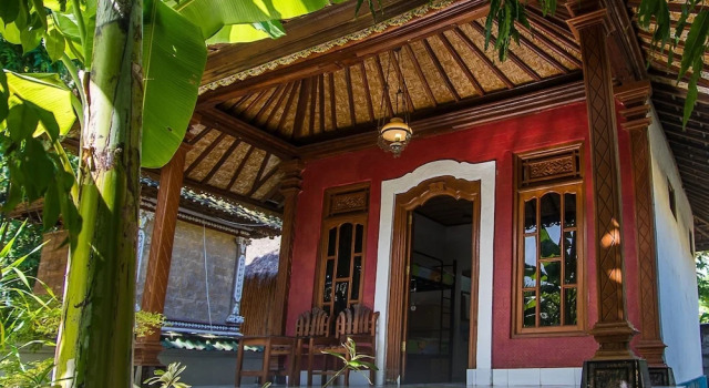 Кровать в общем номере Nusa Garden Bungalow