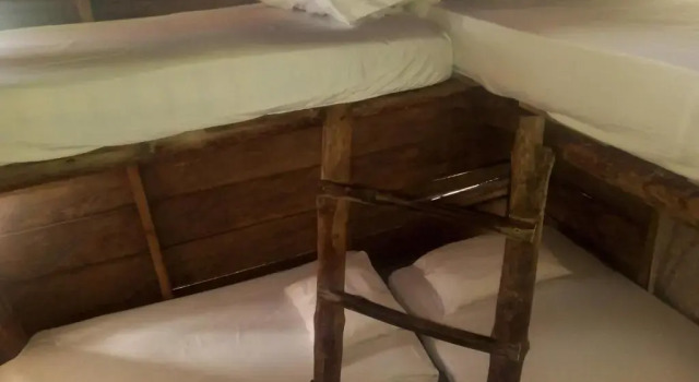 Кровать в общем номере Nuestra Cabañita