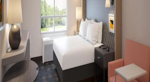 Кровать в общем номере Holiday Inn & Suites Boca Raton - North