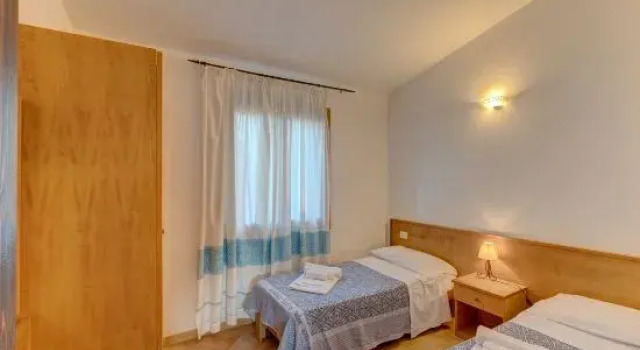 Апартаменты The Fantastic Residenza Badus 2 Bedroom Sleeps 6 - Child