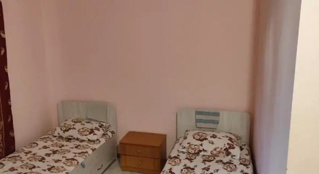 Кровать в общем номере Азия Hotel