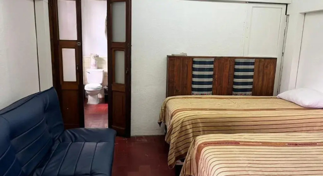 Кровать в общем номере Hostal Antigüeño