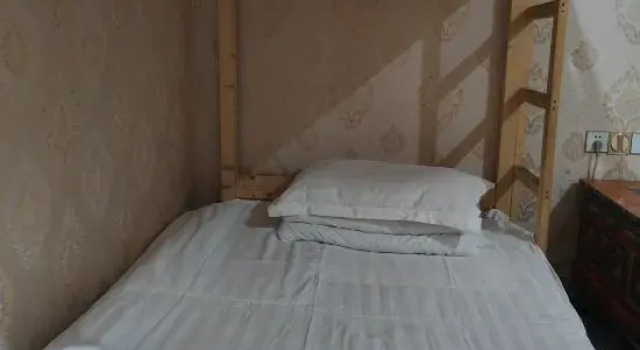 Кровать в общем номере Zhaxi Zhuokang Youth Hostel