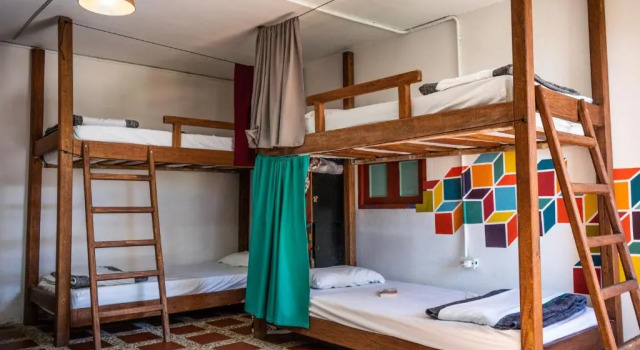 Кровать в общем номере Casa Kayam Hostal y Residencia Artistica
