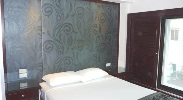 Кровать в общем номере Empress Hotel Ho Chi Minh City