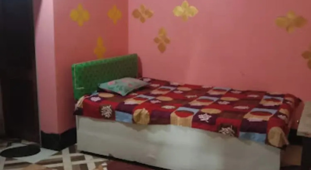 Кровать в общем номере Goroomgo Nirmal Guest House Guwahati