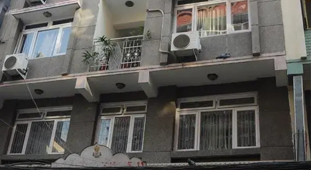Кровать в общем номере с видом на сад The Hotel Pleasure Home Inn