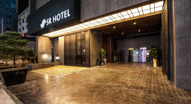 Кровать в общем номере SR Hotel Sadang