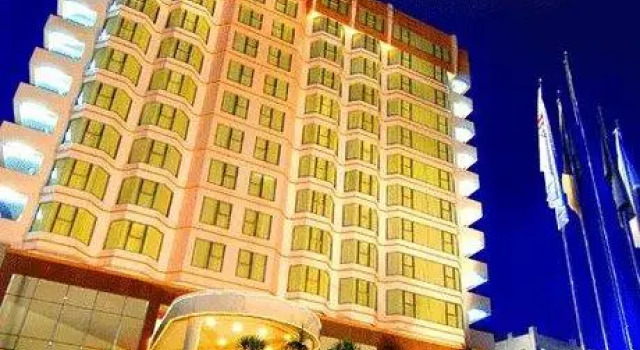 Кровать в общем номере Swiss-Belhotel Borneo Samarinda