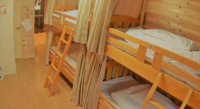 Кровать в общем номере Guest House Ga-Jyun