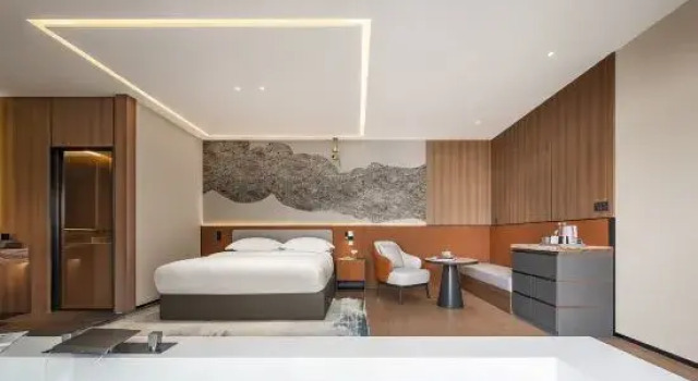 Кровать в общем номере Miyi Family Garden Hotel