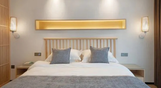 Кровать в общем номере Wuyishan Banshan Villa Homestay (Sangu Resort Area Impression Dahongpao Theater)