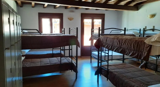 Кровать в общем номере La Casa de Mi Abuela