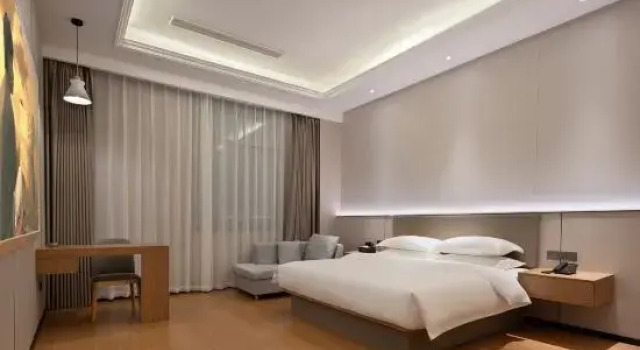 Кровать в общем номере Happy Movie Hotel (Wanning High Speed Rail Station Store)