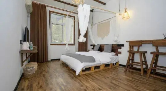 Jihe Xiaozhu Guesthouse, Book Hotel Hoteller og overnatningssteder i Moxi, Hotel