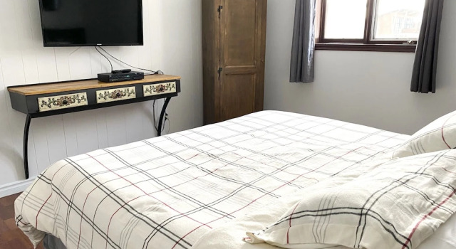 Кровать в общем номере с 6 комнатами Chalets Montmorency Mont-Sainte-Anne
