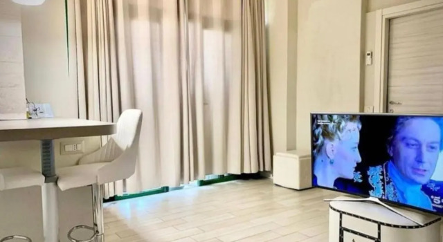 Апартаменты Appartamento via Riccardo Lombardi 29