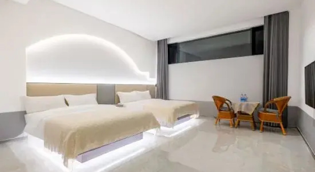 Кровать в общем номере Yihe Lanwan Homestay