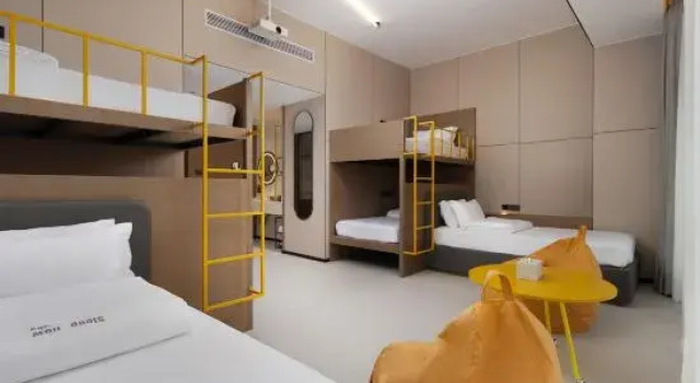 Кровать в общем номере с 6 комнатами JO&JOE Hotel Shaoguan High speed Railway Station