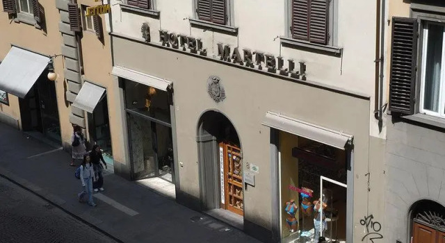Кровать в общем номере Hotel Martelli