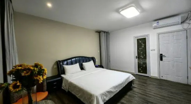 Кровать в общем номере Yueshan Tinghai B&B