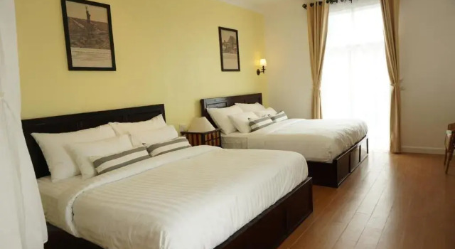 Четырёхместный номер Standard с балконом Nai Suan Bed and Breakfast