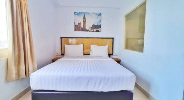 Camera Deluxe De La Charis Hotel by Waringin Hospitality