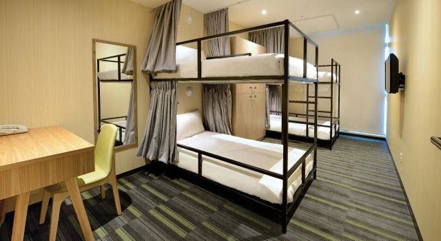 Кровать в общем номере Park City Inn & Hostel