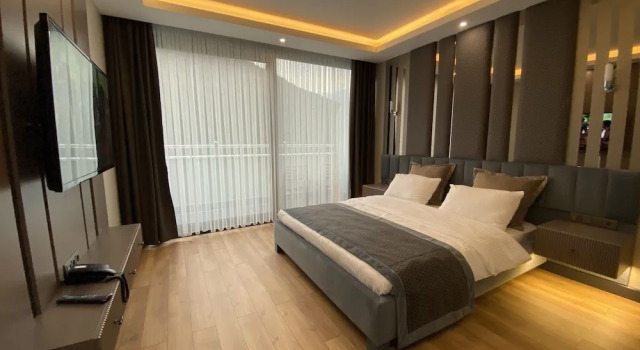 Номер Deluxe c 1 комнатой с балконом Voice Hotel