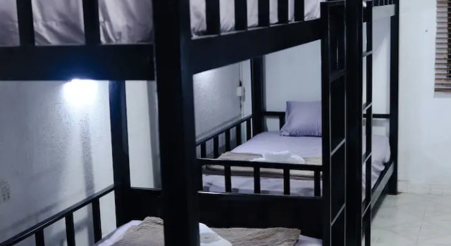 Кровать в общем номере SY Guesthouse