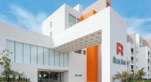 Кровать в общем номере Real Inn Cancún