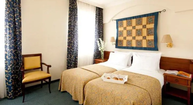 Pat în dormitor Prima Palace Hotel